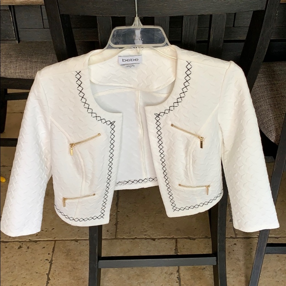 White cropped jacket with black stitching